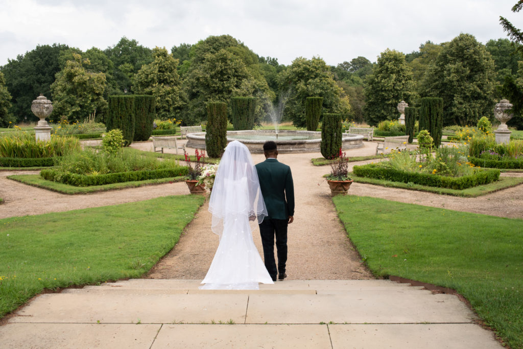 bride and groom in a garden