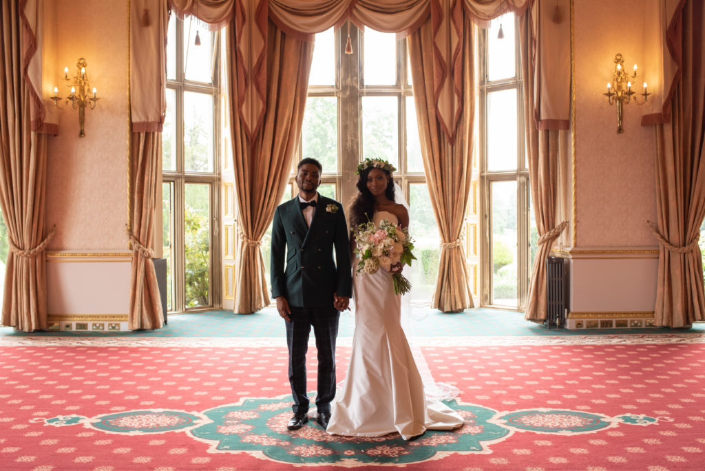 multicultural bride and groom in a room