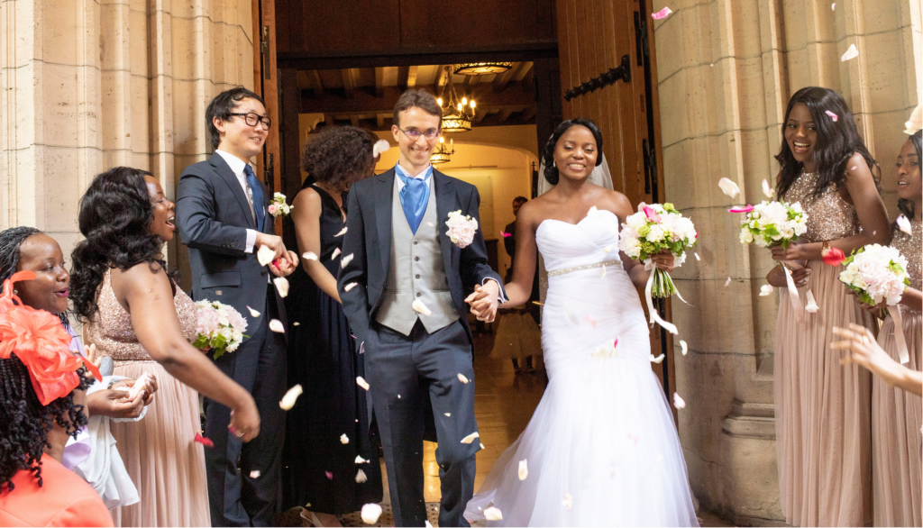 Newly married couple leaving the church